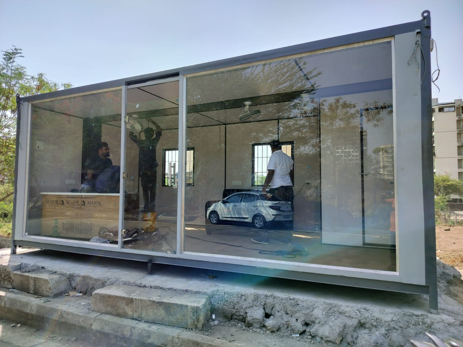 Portable office cabin with full glass front